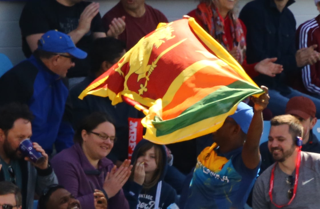 A fan waves the Sri Lanka flag